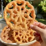 Golden, crispy Mexican buñuelos de viento sprinkled with cinnamon sugar.